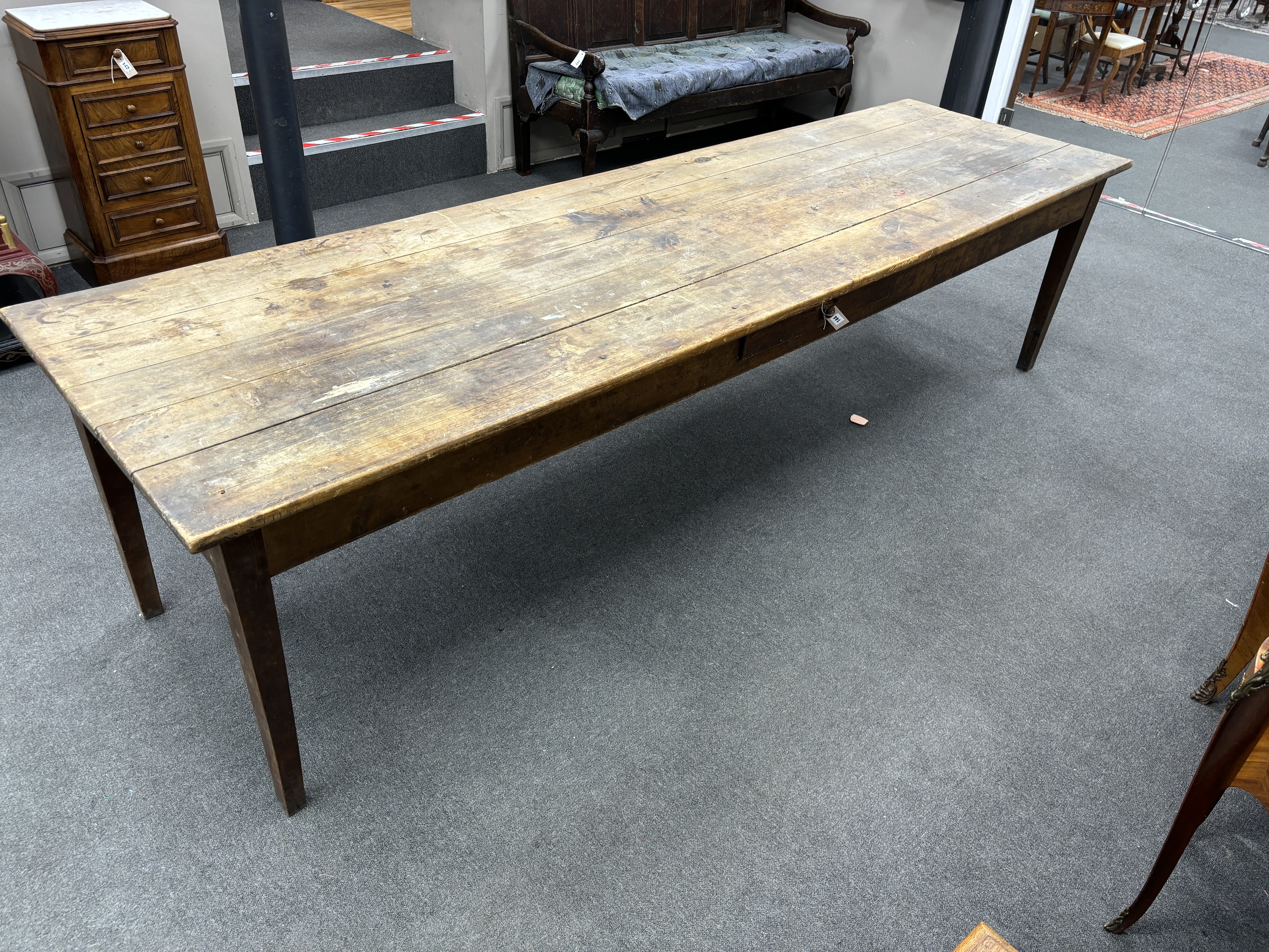 A large 19th century French rectangular fruitwood farmhouse table, fitted drawer, length 290cm, width 83cm, height 75cm